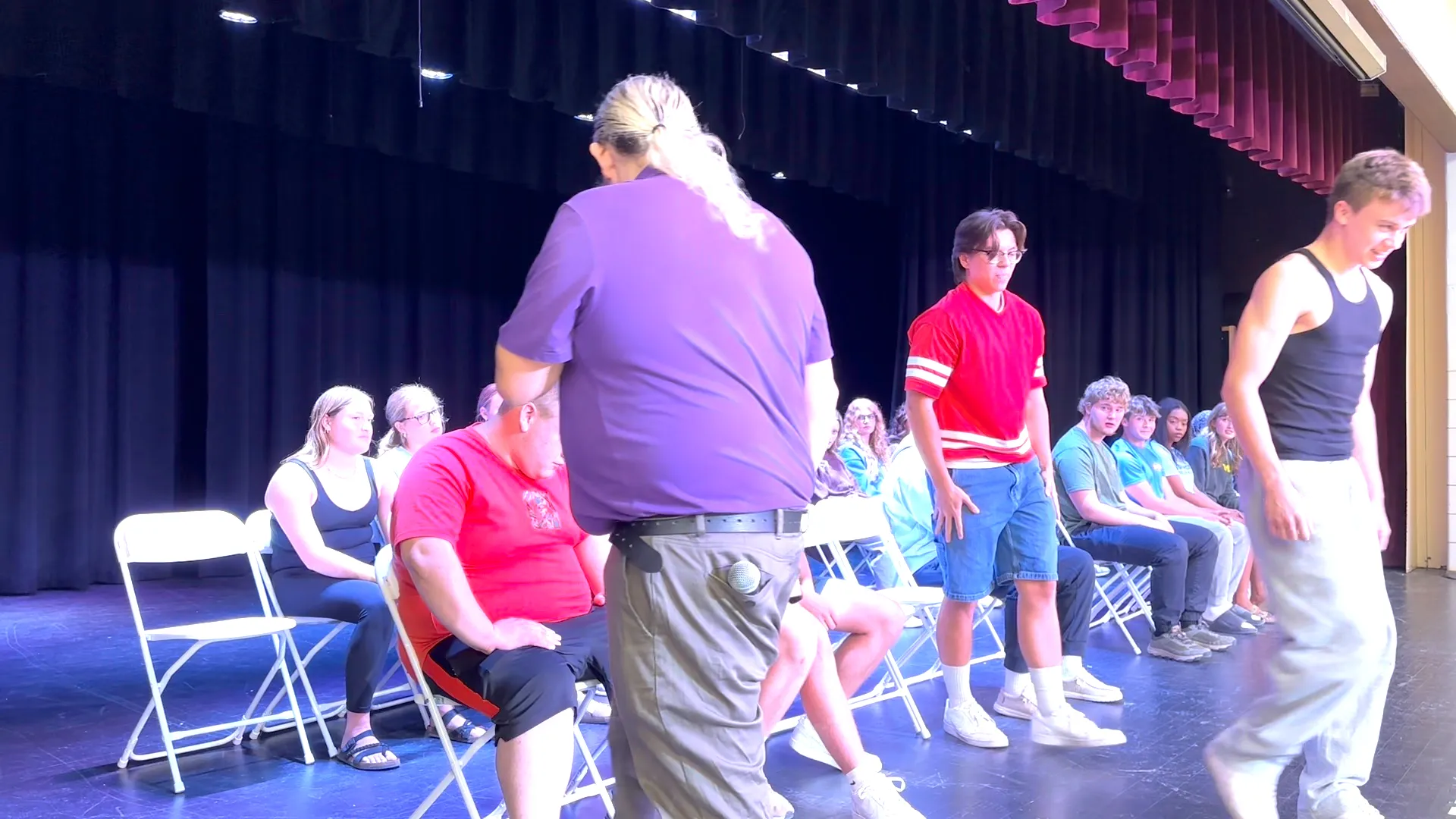 Sending a volunteer back to their seat with a smile