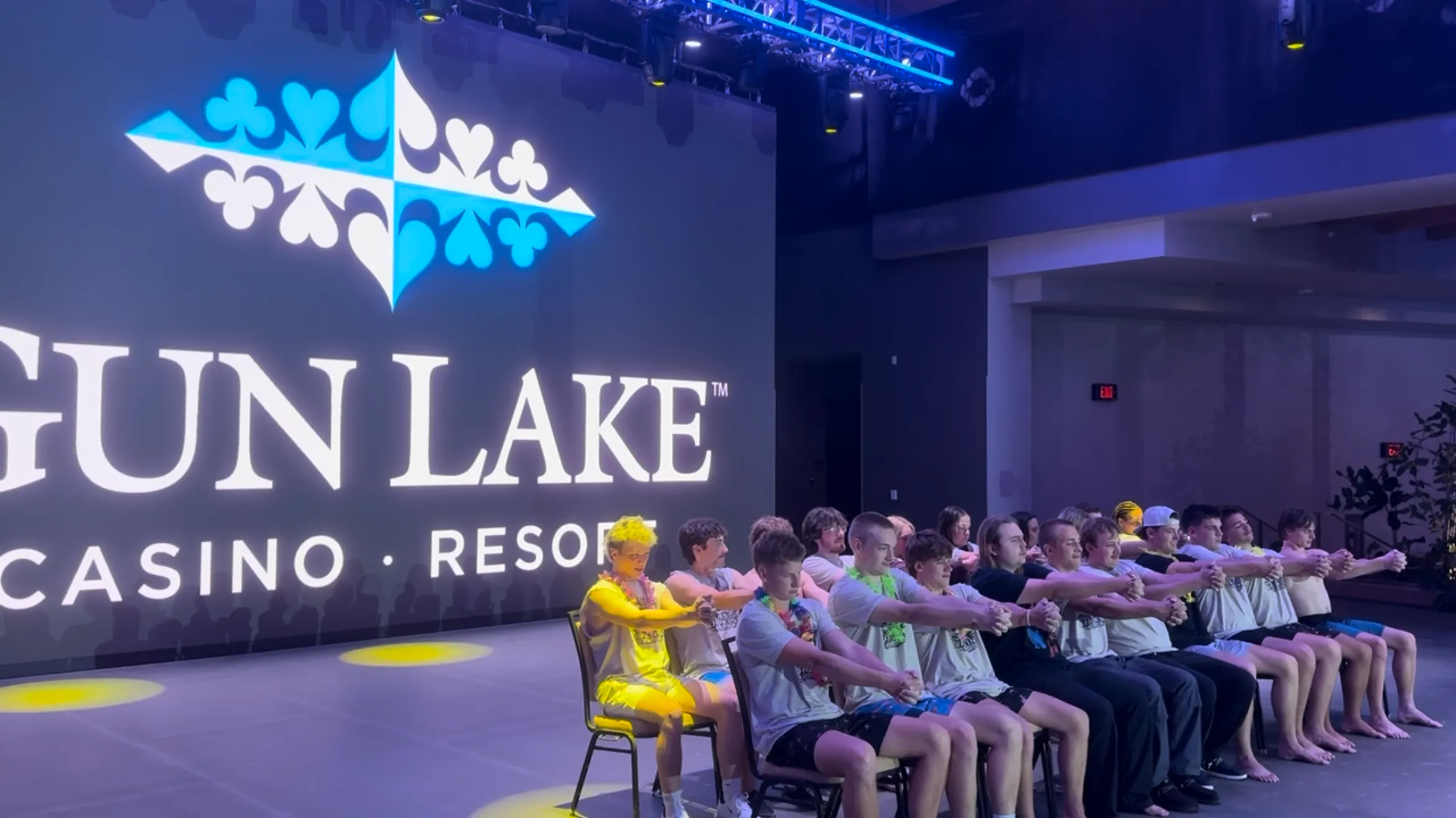 Rows of volunteers with hands locked together during the show