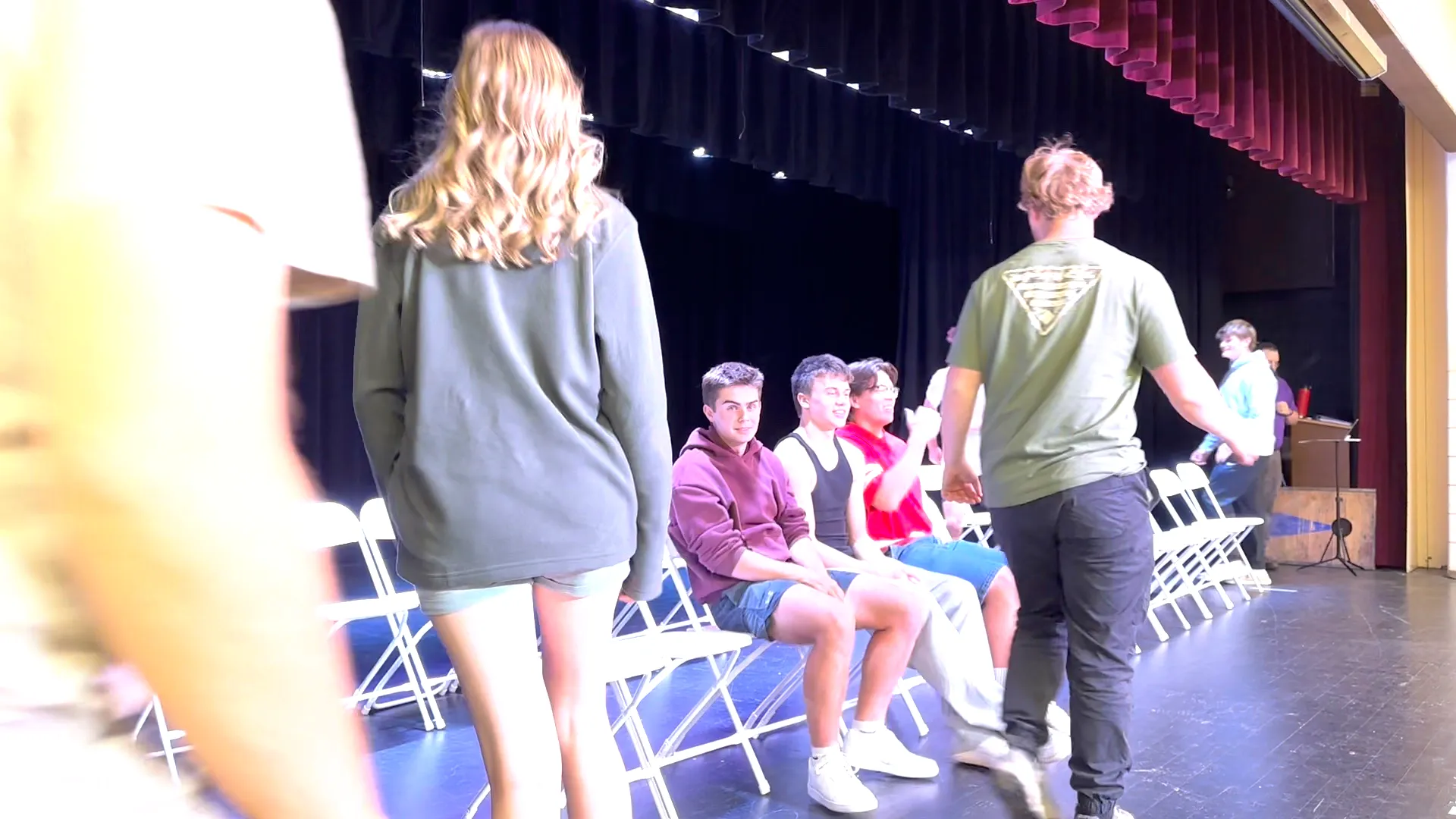 Volunteers making their way up to the stage as the show begins